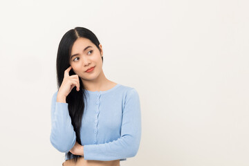 Fototapeta na wymiar Beautiful asian woman thinking. Smiling female standing pose on isolated white background. Attractive Teenager girl around 25 looking at empty space for text feeling excited and thinking.
