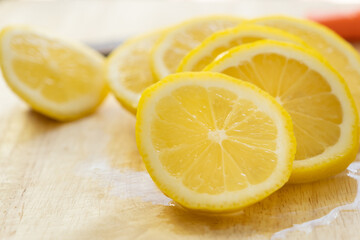 Lemon slices on a wooden cutting board
