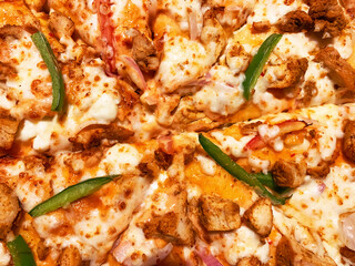 Spicy and Creamy Pizza Texture Background with Jalapeno, Tomato, and Cheese. Pizza backdrop
