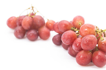 Red fresh red grapes display on white background