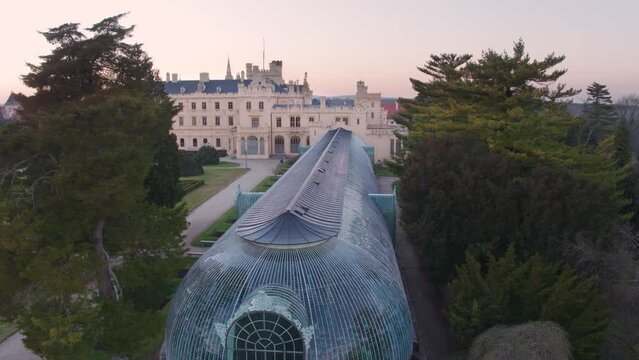 Aerial View Of Lednice Castle, Moravia, Czechia. Famous Tourist Spot. Fairytale Castle In A Baroque Garden, Lit By The Morning Sun. Unesco Cultural Heritage. Winter Season, Moravia, Czech Republic.