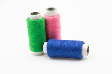three type of yarn over on white background