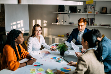 Cinematic image of   employers working in a start up business. Young people at work in a modern office