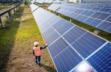 The solar farm(solar panel) with engineers check the operation of the system, Alternative energy to...