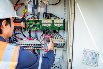 The solar farm(solar panel) with engineers use multimeter check the operation of the system, Alternative energy to conserve the world's energy, Photovoltaic module idea for clean energy production