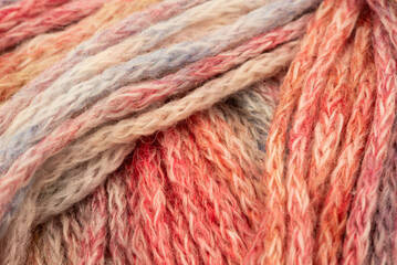 The Netherlands, February 2022. Close up of colored wool on a white background.