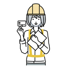 立って書類とカードを手に持つ工事現場の女性
