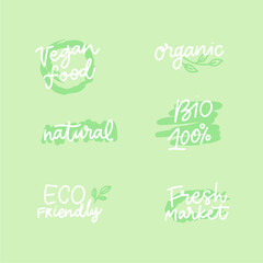 Vegan menu sign for cafe menu. Handmade lettering sticker design with green leaf.