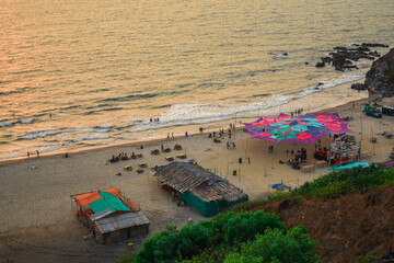 beach huts at sunset