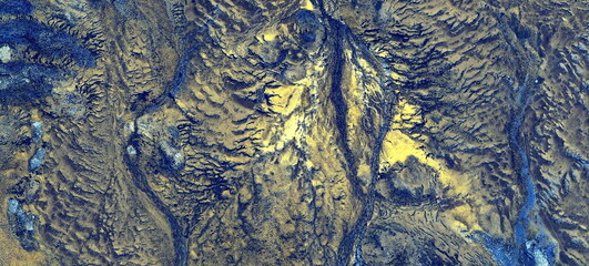	
abstract landscape of the deserts of Africa from the air emulating the shapes and colors of the...