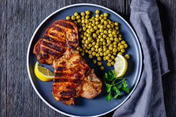 grilled pork t-bone steaks with boiled green peas