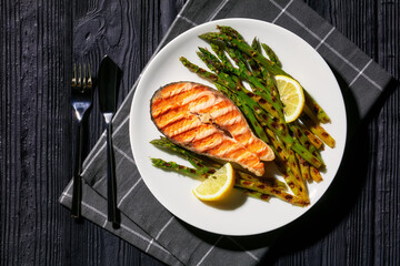 grilled salmon steak with asparagus and lemon