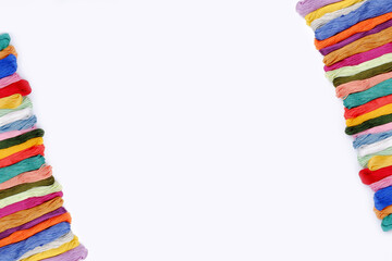 Background of rainbow sewing thread floss for embroidery. Handmade concept, cross-stitch and on a...