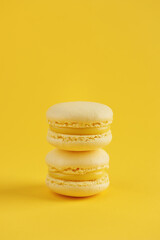 Lemon macaroons on a yellow background