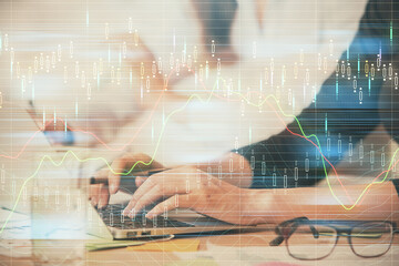 Multi exposure of woman hands typing on computer and financial graph hologram drawing. Stock market analysis concept.