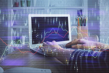 Double exposure of woman hands typing on computer and forex chart hologram drawing. Stock market invest concept.