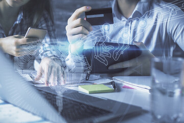 Double exposure of man and woman on-line shopping holding a credit card and brain hologram drawing. Ai and E-commerce pay on-line concept.