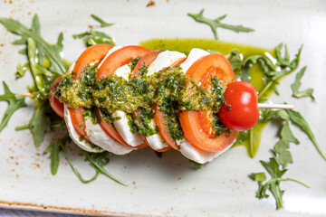 Caprese skewers with pesto sauce, top view