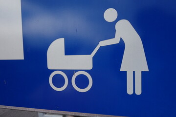 a mother with her child and baby stroller