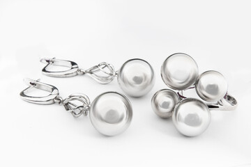 Silver jewels collection with crystals in minimalism style. Silver set of earrings and silver necklace