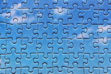 Pieces of Jigsaw puzzle, sky and clouds with blue background