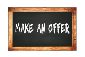 Fototapeta premium MAKE AN OFFER text written on wooden frame school blackboard.