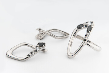 Silver jewels collection with crystals in minimalism style. Silver set of earrings and silver...