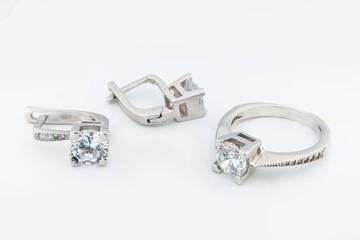Silver jewels collection with crystals in minimalism style. Silver set of earrings and silver...
