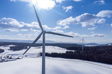 Black Forest with wind energy in snowy winter with space for your content