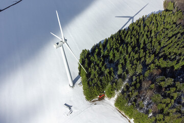 Black Forest with wind energy in snowy winter with space for your content