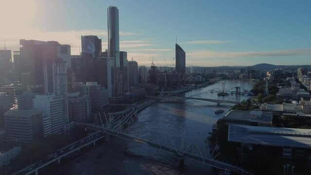 Flooded Brisbane River towards Southbank and city - Drone 4k