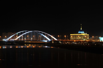 Nur-Sultan / Kazakhstan - 11.07.2011 : Night lighting of streets, bridges and the presidential administration in the Central part of the capital.