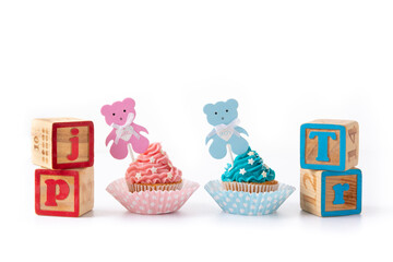 Pink and blue cupcakes for baby shower isolated on white background