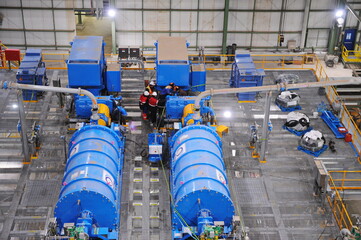 Pavlodar region, Kazakhstan - 12.10.2015 : Generators and pipes at a sulfide ore and copper processing plant