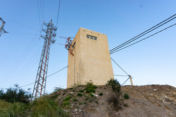 light house and cables on hill