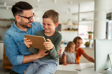 Distance learning, online education, home work concept. Family with digital devices at home.
