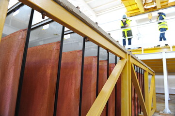 East Kazakhstan region, Kazakhstan - 12.02.2015 : Layers of cathode copper on a special lift for...