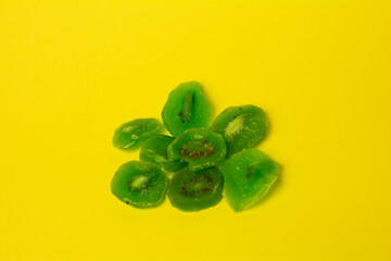 dried kiwi on a yellow background