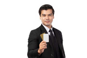 Handsome business man in black suit holding credit card isolated on white background. Business, technology, ecommerce and online payment concept.
