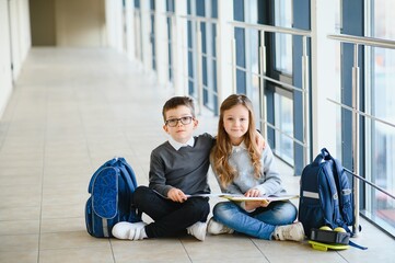 School kids in uniform together in corridor. Conception of education.