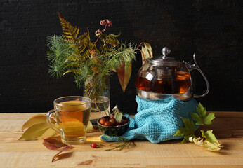 Teapot with herbal autumn tea