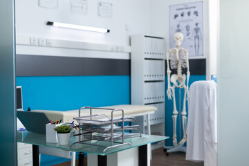 Empty doctor office wth nobody in it equipped with medical professional instrument ready for...
