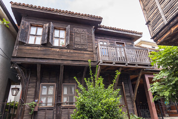 Facades of wooden buildings in Old Town of Sozopol city on Black Sea coast in Bulgaria