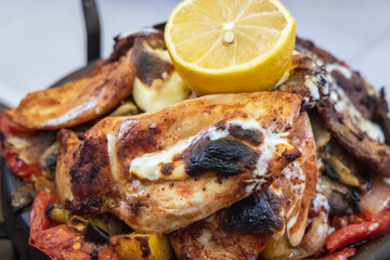 Bulgarian meat dish made in traditional cooking pot called sach