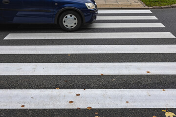 Car on pedestrian crossing in Warsaw city, Poland