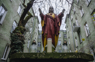 Shrine with statue of Jesus Christ in front of residential building on Targowa Street in Warsaw,...