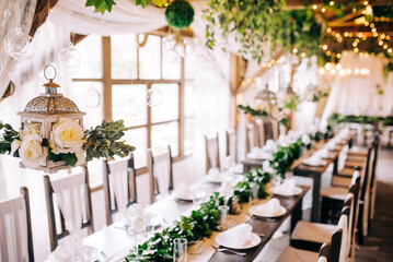 Table setting at a luxury wedding and beautiful flowers on the table.