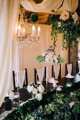 Table setting at a luxury wedding and beautiful flowers on the table.