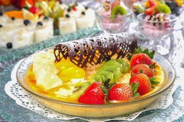 A plate of various fruit pudding
