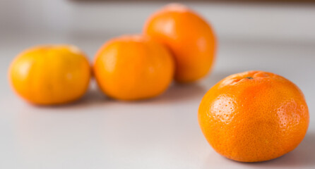 fresh tangerines on white background